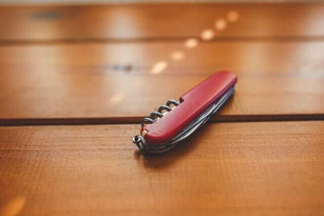 Photograph taken by Pexels.com red-desk-knife-penknife